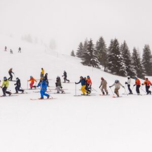 Colorful group shot at Scufoneda 2025 telemark and freeride festival in Dolomites.