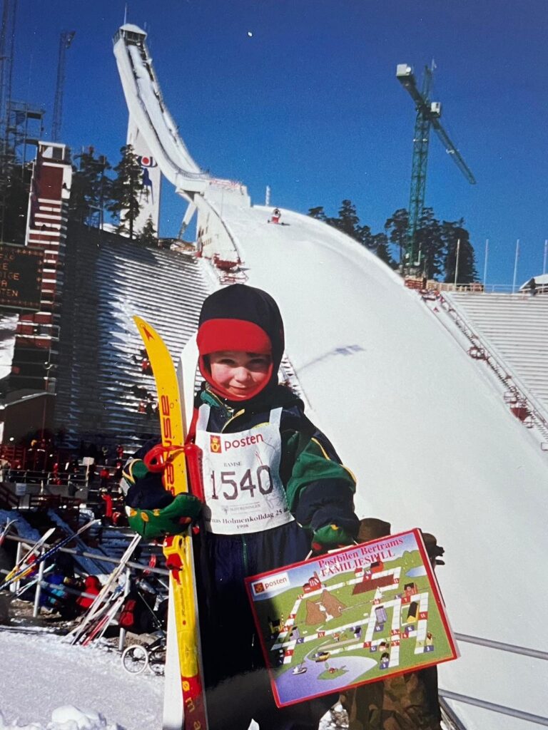 A young Trym Nygaard Løken and children sharing joyful moments with telemark skis—reflecting early childhood connection to skiing.